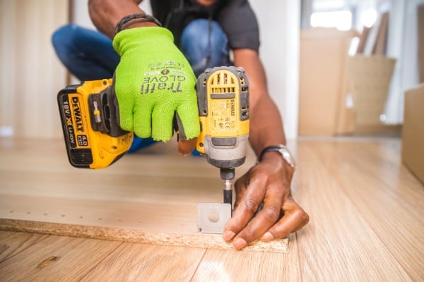 Donate things - Person using impact driver