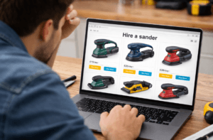 Image of a man looking at sander hire options on a computer screen, which says, 'Hire a sander'.